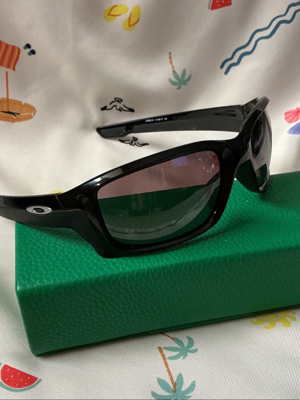Oakley Black Frame Sunglasses with Gray-Purple Lenses